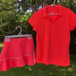 Two girls golf/tennis outfits.